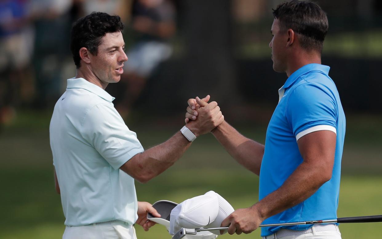Rory McIlroy and Brooks Koepka shake hands  - Copyright 2019 The Associated Press. All rights reserved