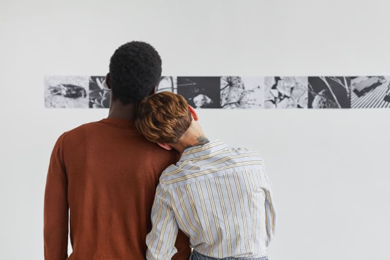 Couple on date night looking at art in museum