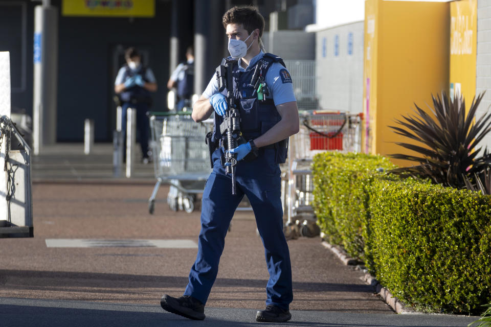 FILE - In this Saturday, Sept. 4, 2021, file photo, armed police patrol outside a supermarket in Auckland, New Zealand. Ahamed Aathil Samsudeen grabbed a kitchen knife from store shelf and begins stabbing shoppers while chanting “Allahu akbar” — meaning “God is great" at the supermarket on Sept. 3, 2021. (AP Photo/Brett Phibbs, File)