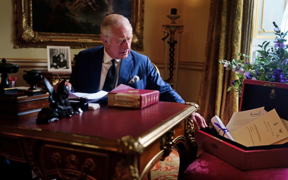 A newly released photo shows King Charles III carrying out official government duties from his red box - Victoria Jones/PA
