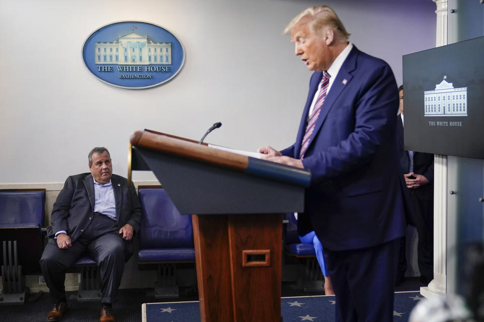 FILE - former New Jersey Gov. Chris Christie, looks on as President Donald Trump speaks during a news conference at the White House, Sept. 27, 2020, in Washington. Christie has been on a PR blitz promoting his new book, “Republican Rescue." It offers a simple prescription for his party: Stop talking about 2020, focus on the future or keep losing elections. His rebuke of former President Donald Trump’s election lies is a message that’s finding traction on cable news airwaves as he stakes out a unique lane for a possible second presidential run. (AP Photo/Carolyn Kaster, File)