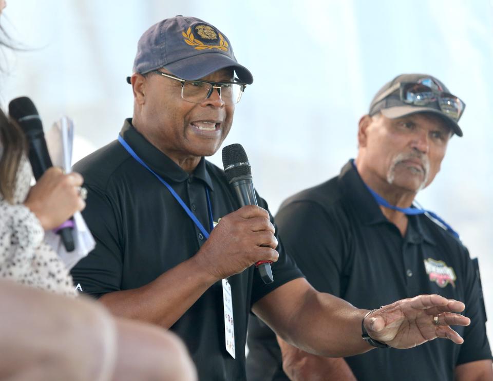 Former NFL great Mike Singletary, left, speaks during the Hall of Fame Village Fatherhood Festival at Tom Benson Hall of Fame Stadium in Canton on Saturday, June 18, 2022. Looking is Hall of Famer Anthony Mu–oz, right.