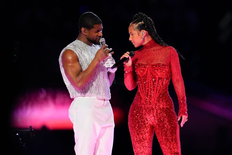 Usher, left, and Alicia Keys perform during halftime of the NFL Super Bowl 58 football game between the San Francisco 49ers and the Kansas City Chiefs on Sunday, Feb. 11, 2024, in Las Vegas. (AP Photo/Julio Cortez)