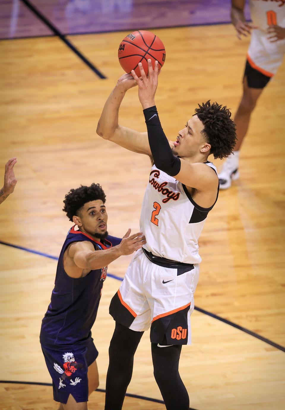Oklahoma State's Cade Cunningham makes a jump shot against Liberty during the NCAA tournament March 19, 2021 in Indianapolis.