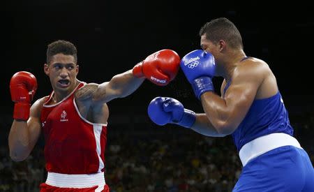 2016 Rio Olympics - Boxing - Final - Men's Super Heavy (+91kg) Final Bout 273 - Riocentro - Pavilion 6 - Rio de Janeiro, Brazil - 21/08/2016. Tony Yoka (FRA) of France and Joseph Joyce (GBR) of Britain compete. REUTERS/Peter Cziborra