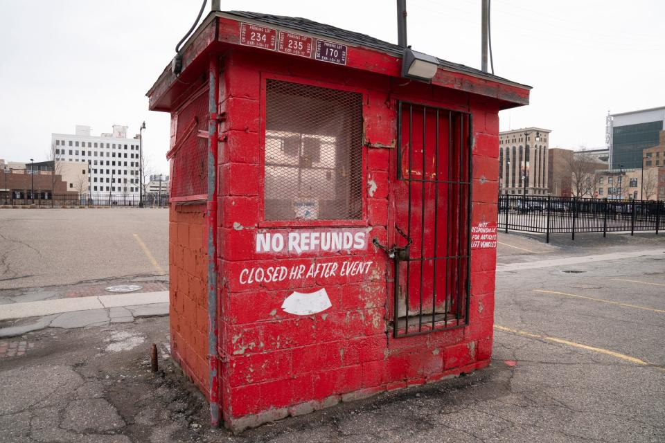 A downtown parking on West Adams between Clifford Street and Cass Avenue on March 30, 2022, had attendants charging parkers only to have the parkers discover tickets on their windshields after a recent event.