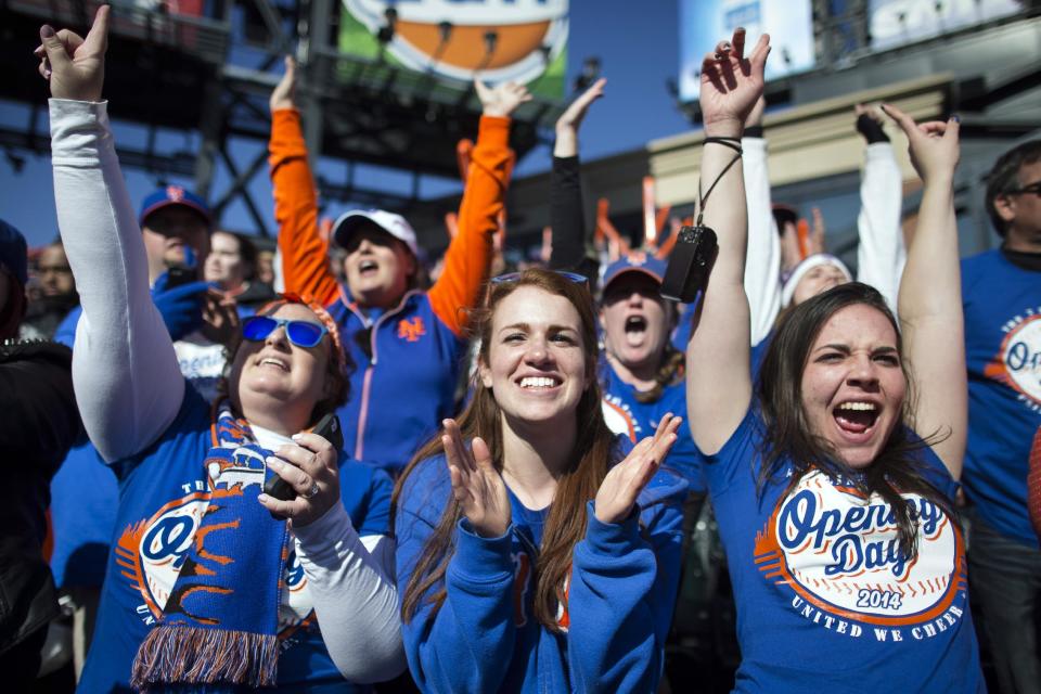 New York Mets fans cheer during a baseball game against the Washington Nationals on opening day at Citi Field, Monday, March 31, 2014, in New York. The Nationals won 9-7. (AP Photo/John Minchillo)