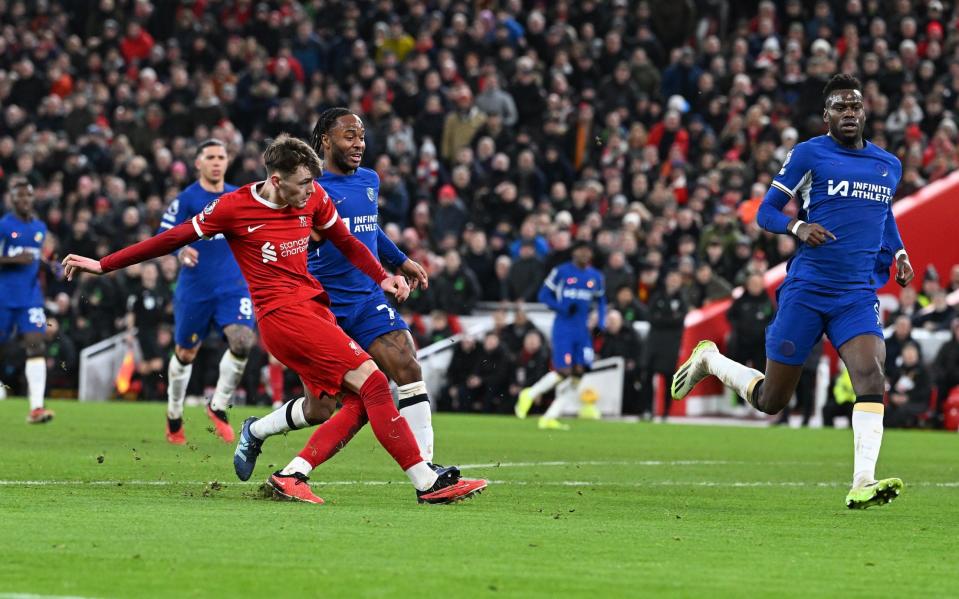 Conor Bradley shoots and scores against Chelsea at Anfield