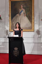 <p>For a feminist speech at Government House, the Duchess of Sussex once again turned to sustainable designer Gabriela Hearst in a bespoke black dress. <em>[Photo: Getty]</em> </p>