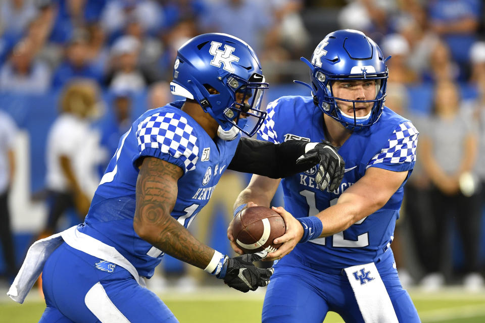 Kentucky quarterback Sawyer Smith (12) hands the ball off to running back Asim Rose (10) during the first half of an NCAA college football game in Lexington, Ky., Saturday, Sept. 14, 2019. (AP Photo/Timothy D. Easley)