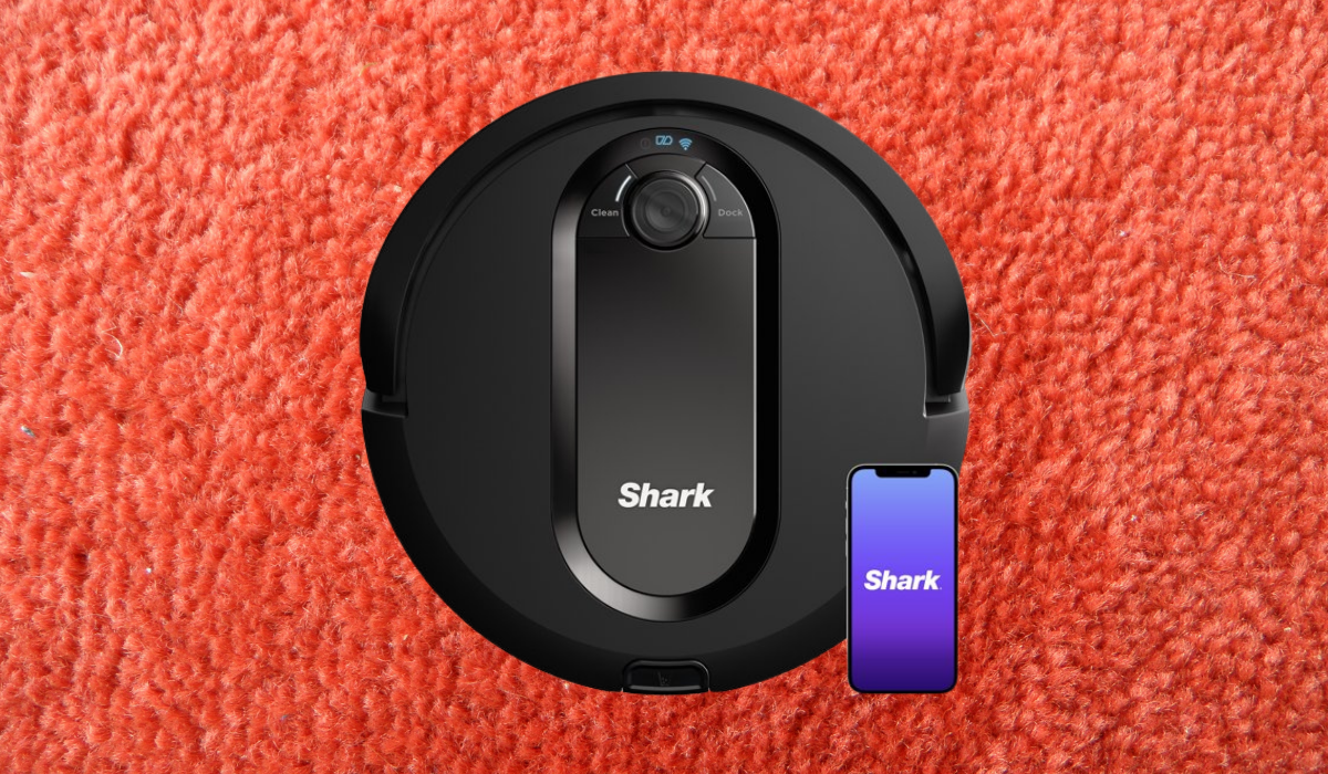 A black robot vacuum labeled 