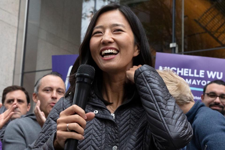 Boston mayoral candidate Michelle Wu campaigns in this file photo from Oct. 23, 2021. On Tuesday, Wu, a daughter of Taiwanese immigrants, faces off against Annissa Essaibi George. Whoever wins will be the first woman and first person of color elected to the city's top political office.