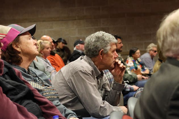 Warren Roberts, a sheep rancher, watches a public comment meeting on the state's wolf reintroduction plan in Rifle, Colorado, on Feb. 7.