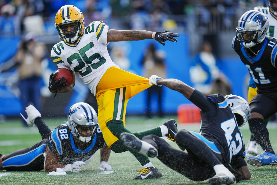 Green Bay Packers cornerback Keisean Nixon pulls a way from Carolina Panthers safety Sam Franklin Jr. during the second half of an NFL football game Sunday, Dec. 24, 2023, in Charlotte, N.C. (AP Photo/Rusty Jones)