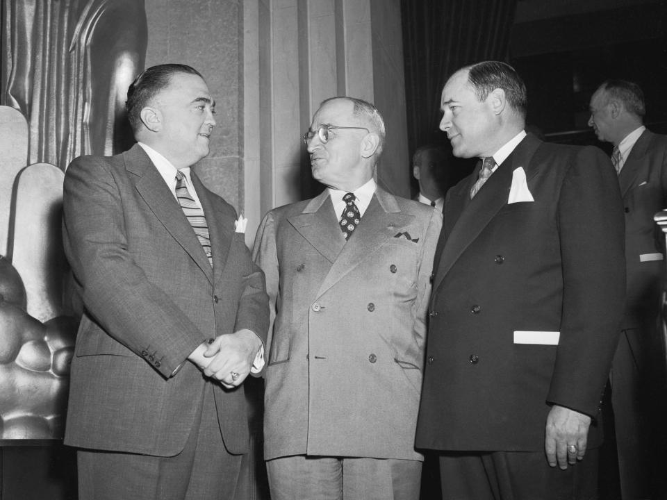 President Harry Truman is greeted by FBI Director J. Edgar Hoover and US Attorney General J. Howard McGrath.
