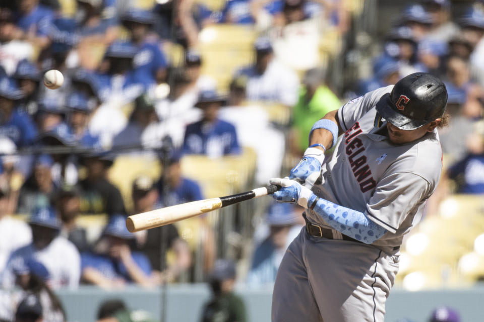 Cleveland Guardians' Josh Naylor hits a double during the ninth inning of a baseball game against the Los Angeles Dodgers in Los Angeles, Sunday, June 19, 2022. (AP Photo/Kyusung Gong)