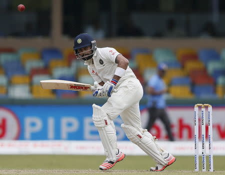 India's captain Virat Kohli plays a shot during the first day of their third and final test cricket match against Sri Lanka in Colombo August 28, 2015. REUTERS/Dinuka Liyanawatte