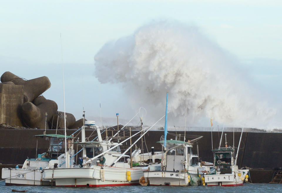 High waves hit a breakwater in Kihocho, Mie prefecture, western Japan Sunday, Sept. 30, 2012. A powerful typhoon is heading to Tokyo after injuring dozens of people, causing blackouts and paralyzing traffic in southern Japan. (AP Photo/Kyodo News) JAPAN OUT, MANDATORY CREDIT, NO LICENSING IN CHINA, FRANCE, HONG KONG, JAPAN AND SOUTH KOREA