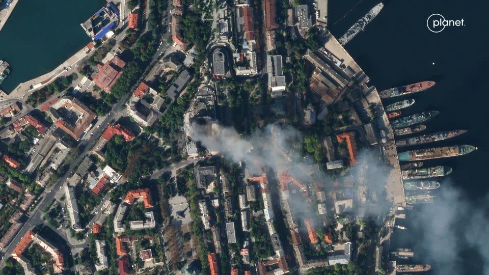 A satellite image shows smoke billowing from Russia's Black Sea fleet headquarters after a missile strike in Sevastopol, Crimea, on September 22 2023. - Planet Labs PBC/Handout/Reuters