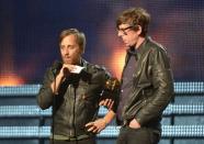 Dan Auerbach (L) and Patrick Carney from The Black Keys receive their Grammy for Best Rock Performance at the Staples Center during the 55th Grammy Awards in Los Angeles, California, on February 10, 2013