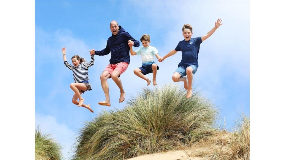 Prince William jumping with George, Charlotte and Louis on Norfolk beach