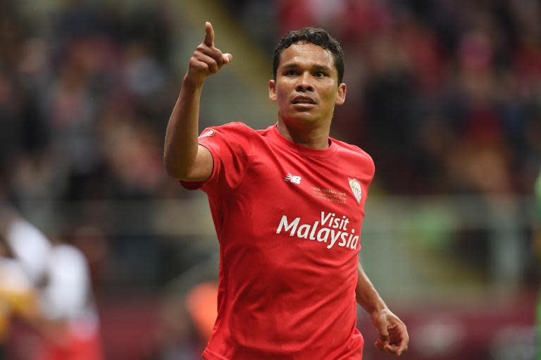 Sevilla's Colombian forward Carlos Bacca reacts after scoring during the UEFA Europa League final football match between FC Dnipro Dnipropetrovsk and Sevilla FC at the Narodowy stadium in Warsaw, Poland on May 27, 2015. AFP PHOTO / PIOTR HAWALEJ