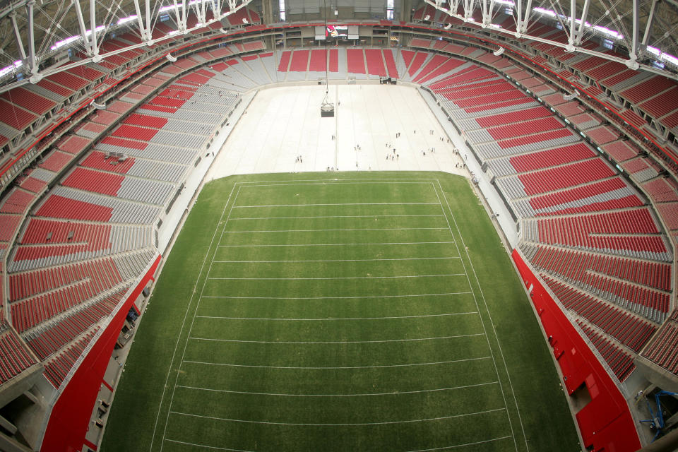 State Farm Stadium, where the Arizona Cardinals play and where Super Bowl LVII will be played, uses a retractable natural grass field that can be rolled outside to gain sunlight. (Gene Lower/Getty Images)