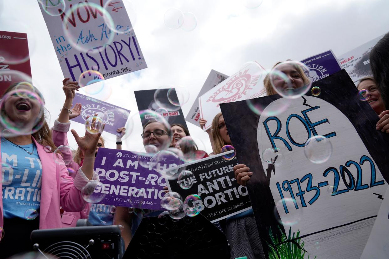 Demonstrators react outside the Supreme Court in Washington, Friday, June 24, 2022. The Supreme Court has ended constitutional protections for abortion that had been in place for nearly 50 years in a decision by its conservative majority to overturn Roe v. Wade.