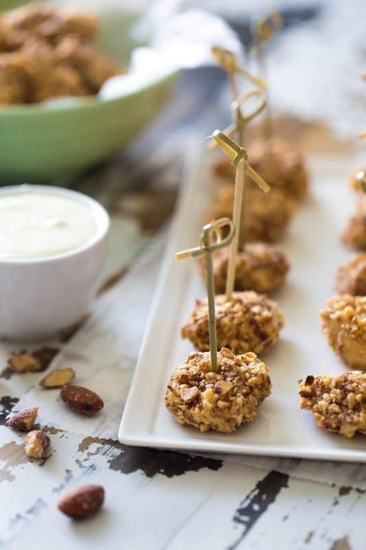 <p>Food Faith Fitness</p><p>They take only 20 minutes to make and six ingredients. Plus, they are baked not fried, for fewer calories.</p><p><strong>Get the recipe: <a href="https://www.foodfaithfitness.com/almond-crusted-chicken-bites-honey-mustard-dip/" rel="nofollow noopener" target="_blank" data-ylk="slk:Almond Crusted Chicken Bites with Honey Mustard Dip;elm:context_link;itc:0;sec:content-canvas" class="link ">Almond Crusted Chicken Bites with Honey Mustard Dip</a></strong></p>