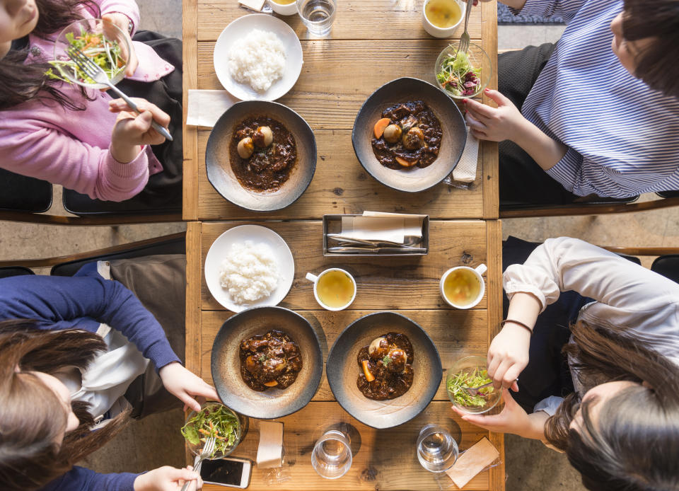 After more than a year of social distancing and staying at home during the pandemic, it may take a while before customers warm up to the idea of communal tables again. (Photo: petriartturiasikainen via Getty Images)