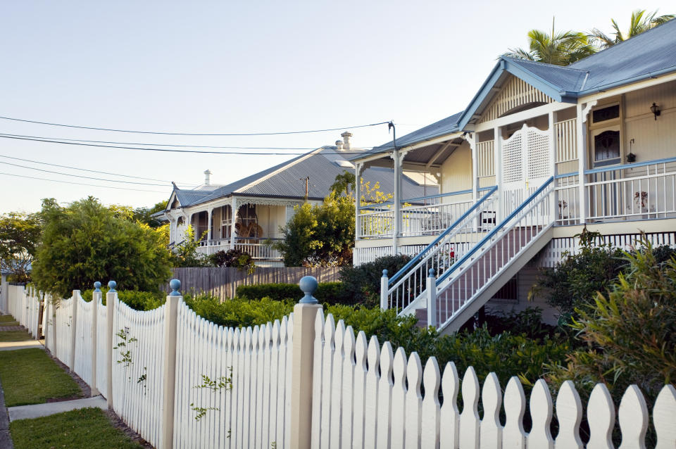 Typical restored traditional 'Queenslander' homes on a suburban street.