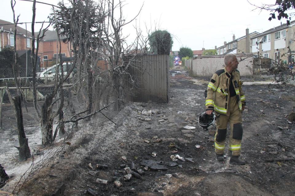 Firefighters in Maltby after a fire started on scrubland before spreading to outbuildings, fences and homes (South Yorkshire Fire Twitter/PA) (PA Media)