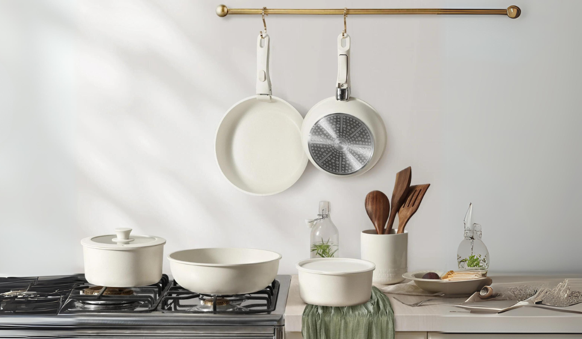 white 17-piece cookware set on a counter and stovetop