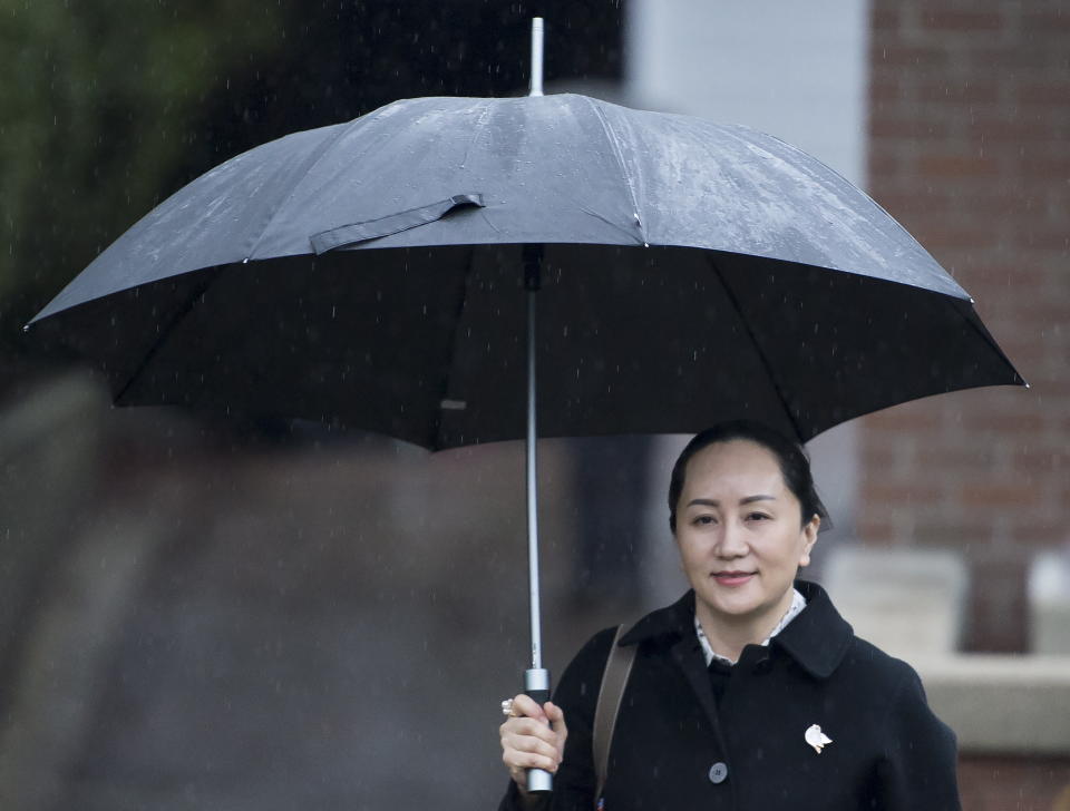 Meng Wanzhou, chief financial officer of Huawei, leaves her home to go to B.C. Supreme Court in Vancouver, Thursday, January, 23, 2020. Wanzhou is in court for hearings over an American request to extradite the executive of the Chinese telecom giant Huawei on fraud charges. (Jonathan Hayward/The Canadian Press via AP)