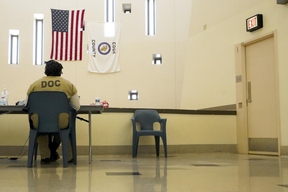 Tykarri Skillon, an inmate at the Cook County, Ill., jail sits to register, then vote for a local election at the jail's Division 11 Chapel on Saturday, Feb. 18, 2023, in Chicago. (AP Photo/Charles Rex Arbogast)