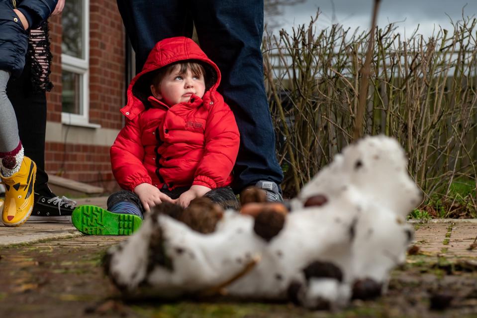 Three-year-old Joseph Taylor was left in floods of tears after watching a grinning binman boot the head off his 6ft-tall snowman (SWNS)