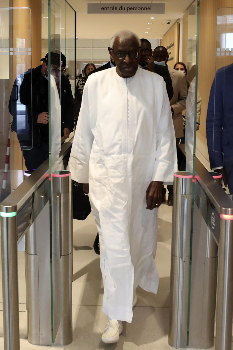 Former president of the IAAF (International Association of Athletics Federations) Lamine Diack arrives at the Paris courthouse, Wednesday, June 10, 2020. A sweeping sports corruption trial opened Monday in Paris involving allegations of a massive doping cover-up that reached to the top of world track and field's governing body. Lamine Diack, 87, who served as president of the body for nearly 16 years, is among those accused of receiving money from Russian athletes to hide their suspected doping so they could compete at the Olympics in 2012 and other competitions. (AP Photo/Thibault Camus)