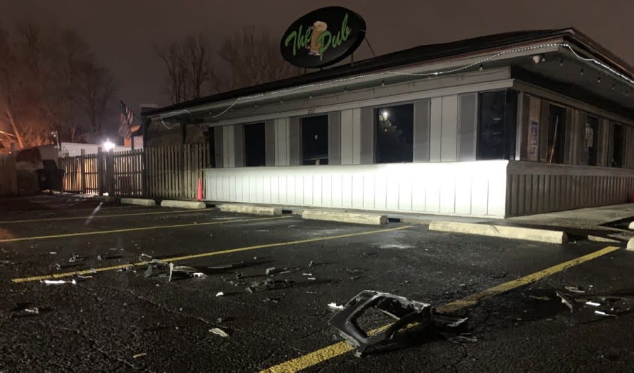 Damage is littered in the parking lot of The Pub in Gahanna after a police cruiser was struck. (NBC4/El Richards)