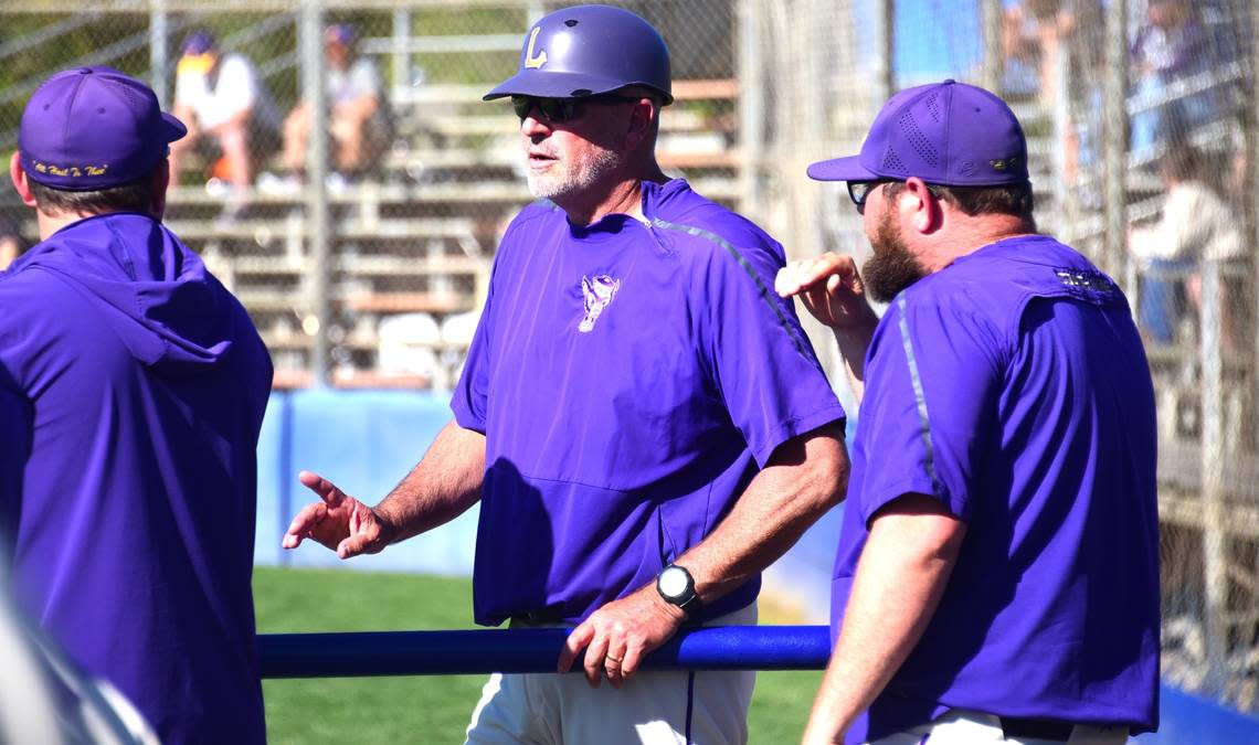 Livingston High School baseball coach Matt Winton chats with his assistant coaches during a Wolves game on Tuesday, April 2, 2024 at Atwater’s Memorial Ballpark. Winton has coached his alma mater for 31 seasons. Shawn Jansen/Sjansen@mercedsun-star.com