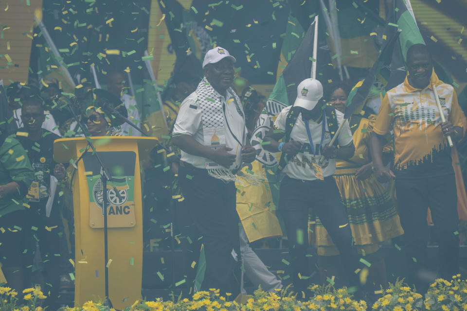 South African President Cyril Ramaphosa celebrates after delivering his speech at the Mose Mabhida stadium in Durban, South Africa, Saturday, Feb. 24, 2024, for the African National Congress national manifesto launch in anticipation of the 2024 general elections. (AP Photo/Jerome Delay)