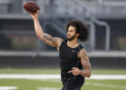 Free agent Colin Kaepernick participates in a workout for NFL football scouts and media Saturday, Nov. 16, 2019 in Riverdale, Ga. (AP Photo/Todd Kirkland)