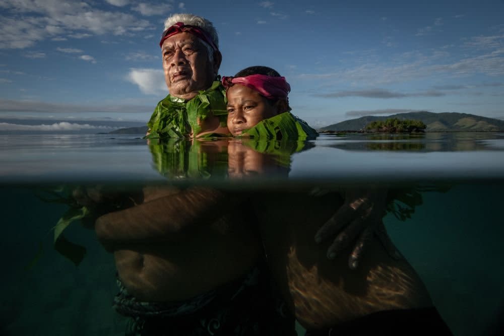 Lotomau Fiafia with his grandson John, Salia Bay, Kioa Island, Fiji, 8 August 2023