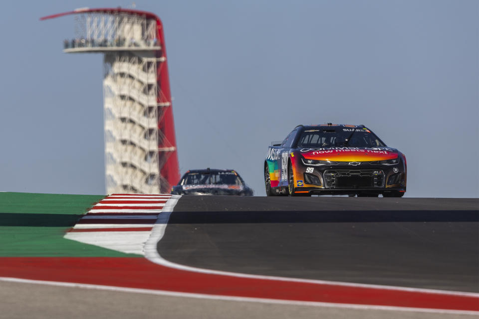 Daniel Suarez steers his car through Turn 10 during practice for the NASCAR Cup Series auto race at Circuit of the Americas, Saturday, March 26, 2022, in Austin, Texas. (AP Photo/Stephen Spillman)