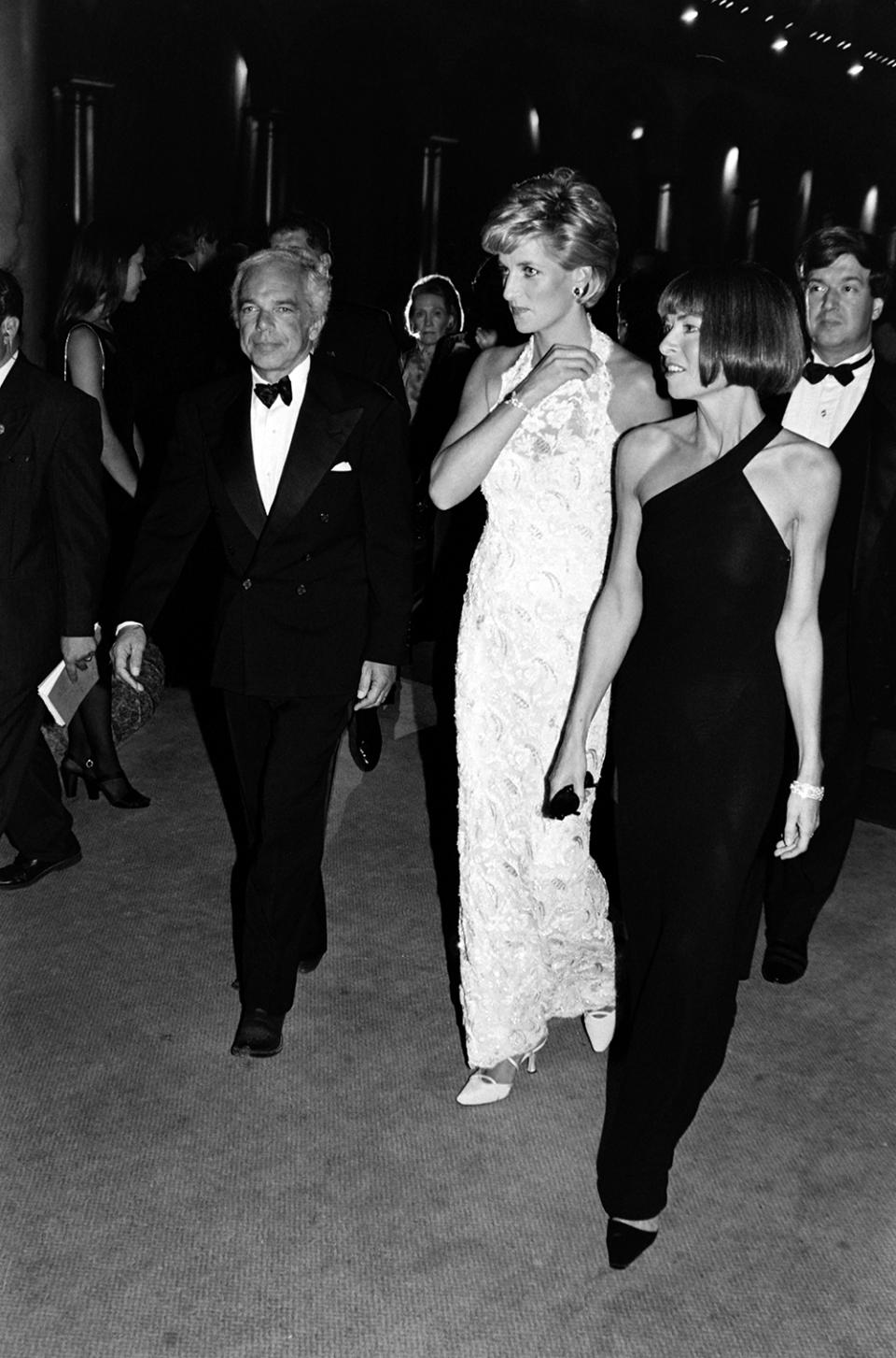 (L-R, foreground) Ralph Lauren; Diana Spencer, Princess of Wales; and Anna Wintour attend the Super Sale gala fundraiser, benefitting the Nina Hyde Center for Breast Cancer Research, at the National Building Museum in Washington, D.C., on September 25, 1966.