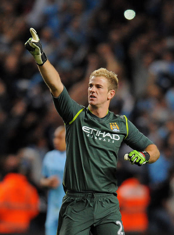 Manchester City's English goalkeeper Joe Hart celebrates after beating Manchester United during their English Premier League football match at The Etihad stadium in Manchester, north-west England on April 30, 2012. AFP PHOTO/ANDREW YATES RESTRICTED TO EDITORIAL USE. No use with unauthorized audio, video, data, fixture lists, club/league logos or “live” services. Online in-match use limited to 45 images, no video emulation. No use in betting, games or single club/league/player publications.ANDREW YATES/AFP/GettyImages