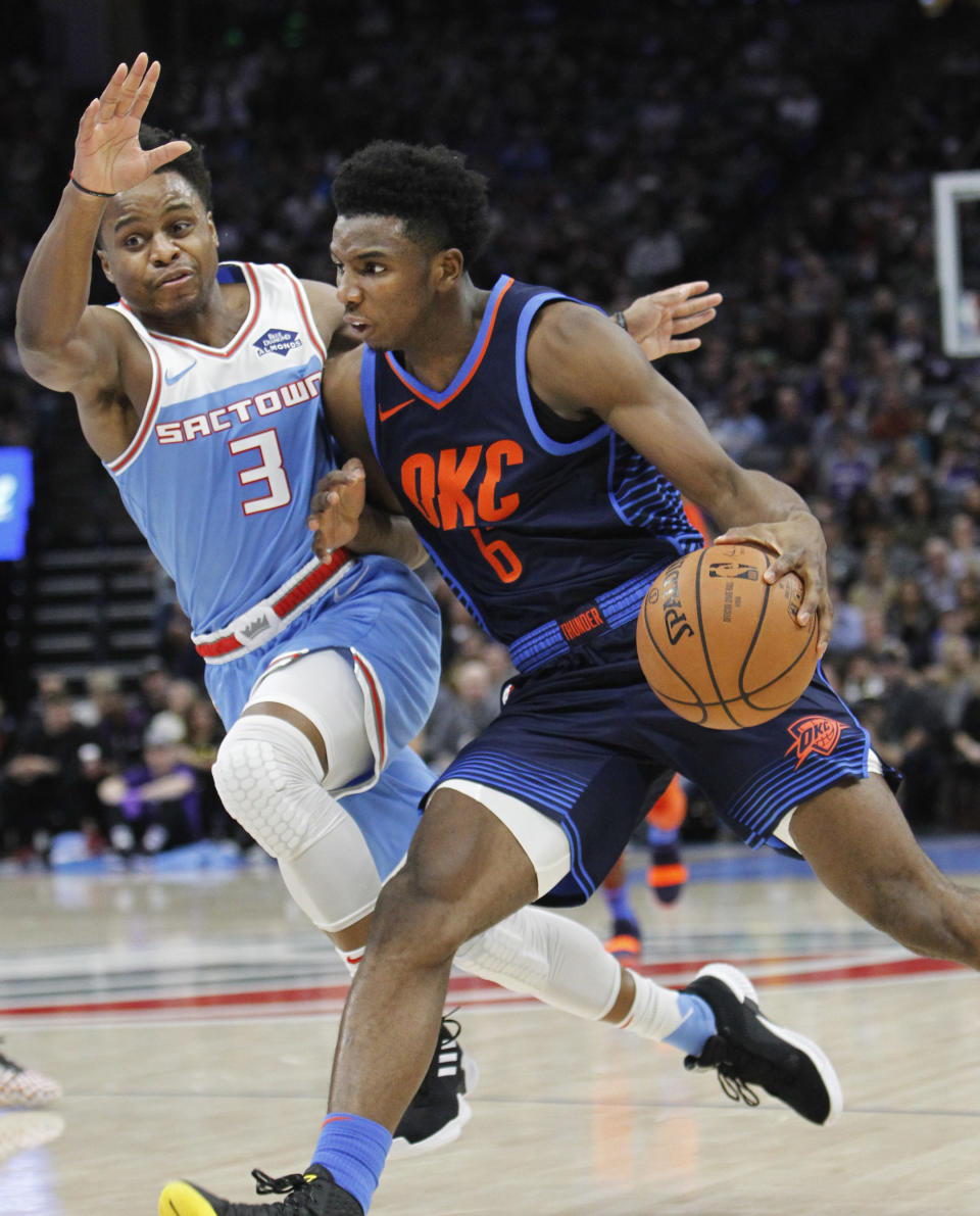 Oklahoma City Thunder guard Hamidou Diallo (6) drives to the basket against Sacramento Kings guard Yogi Ferrell (3) during the first half of an NBA basketball game in Sacramento, Calif., Wednesday, Dec. 19, 2018. (AP Photo/Steve Yeater)