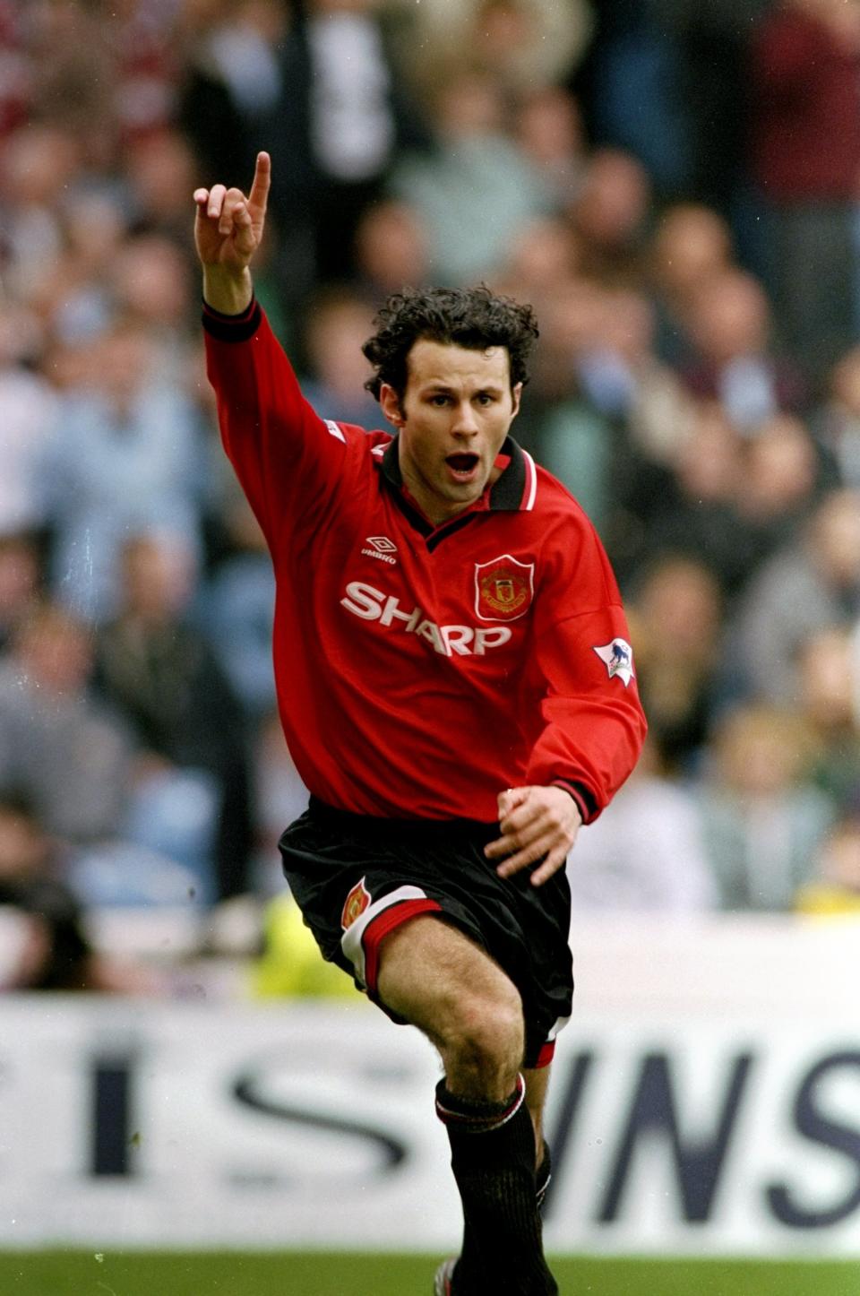 Ryan Giggs of Manchester United celebrates during an FA Carling Premiership match against Manchester City at Maine Road.