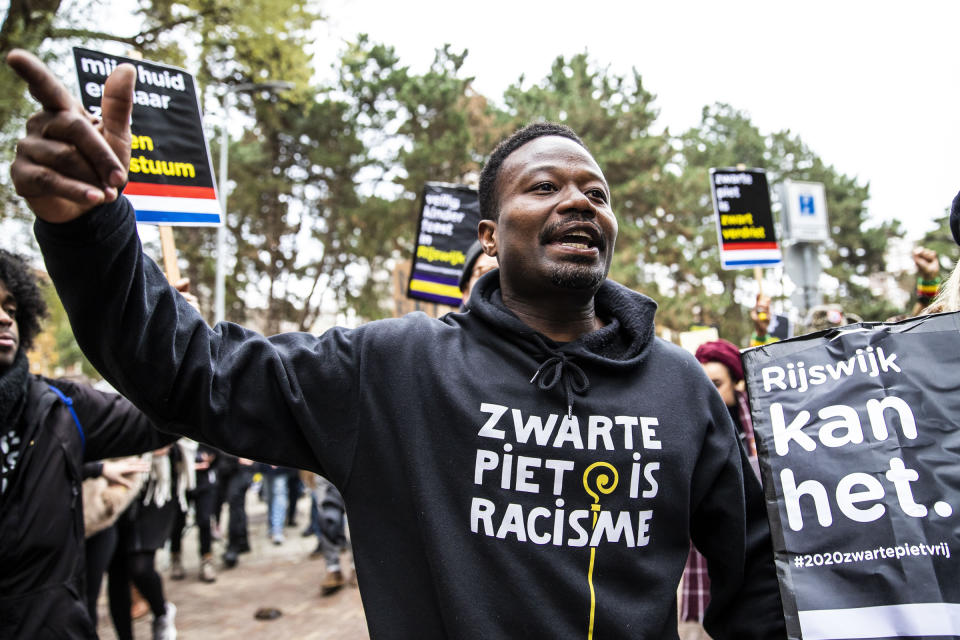 Dutch anti-discrimination activist Jerry Afriyie (C), leader of the 'Kick Out Zwarte Piet' (Kick Out Black Pete) movement, during a protest in Rijswijk, the Netherlands, on Nov. 23, 2019.<span class="copyright">Lauren van Putten—Hollandse Hoogte/Redux</span>