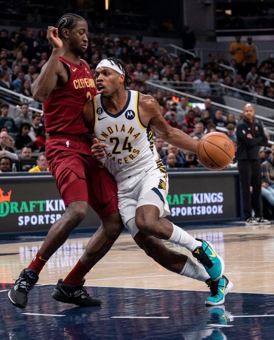 Indiana Pacers guard Buddy Hield (24) drives on Cleveland Cavaliers guard Caris LeVert (3) on Thursday, Dec. 29, 2022, at Gainbridge Fieldhouse in Indianapolis. 