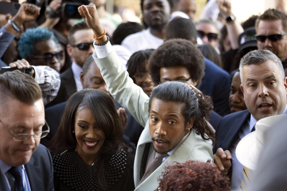 State Rep. Justin Jones, D-Nashville, raises his fist as he walks into the state Capitol Monday, April 10, 2023, in Nashville, Tenn. Jones, who was expelled last week from the GOP-led Tennessee House over his role in a gun-control protest on the House floor, was reinstated Monday after Nashville’s governing council voted to send him straight back to the Legislature. (AP Photo/George Walker IV)